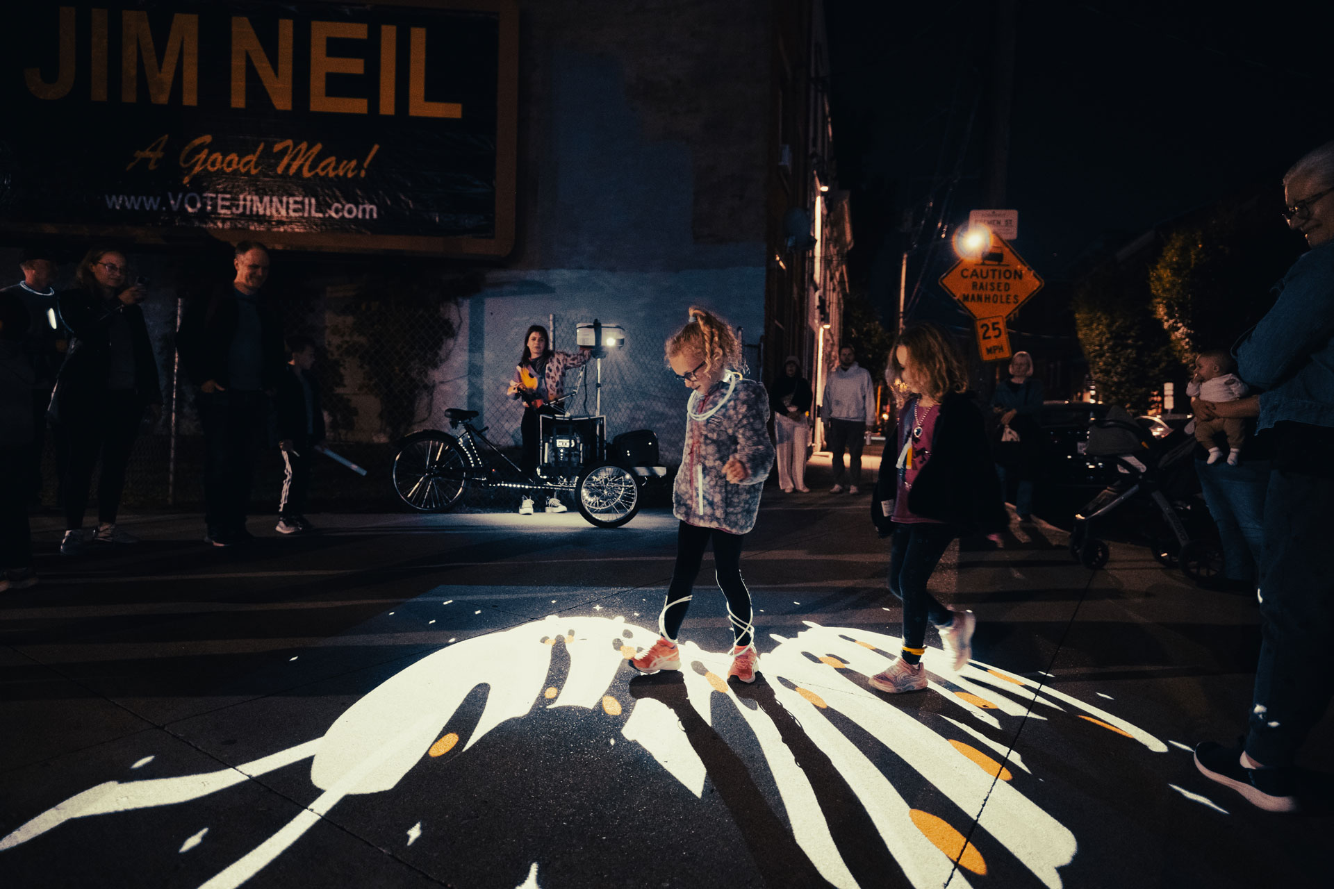 VJ Suave Suaveciclo conducting mobile projection mapping on a street surface
