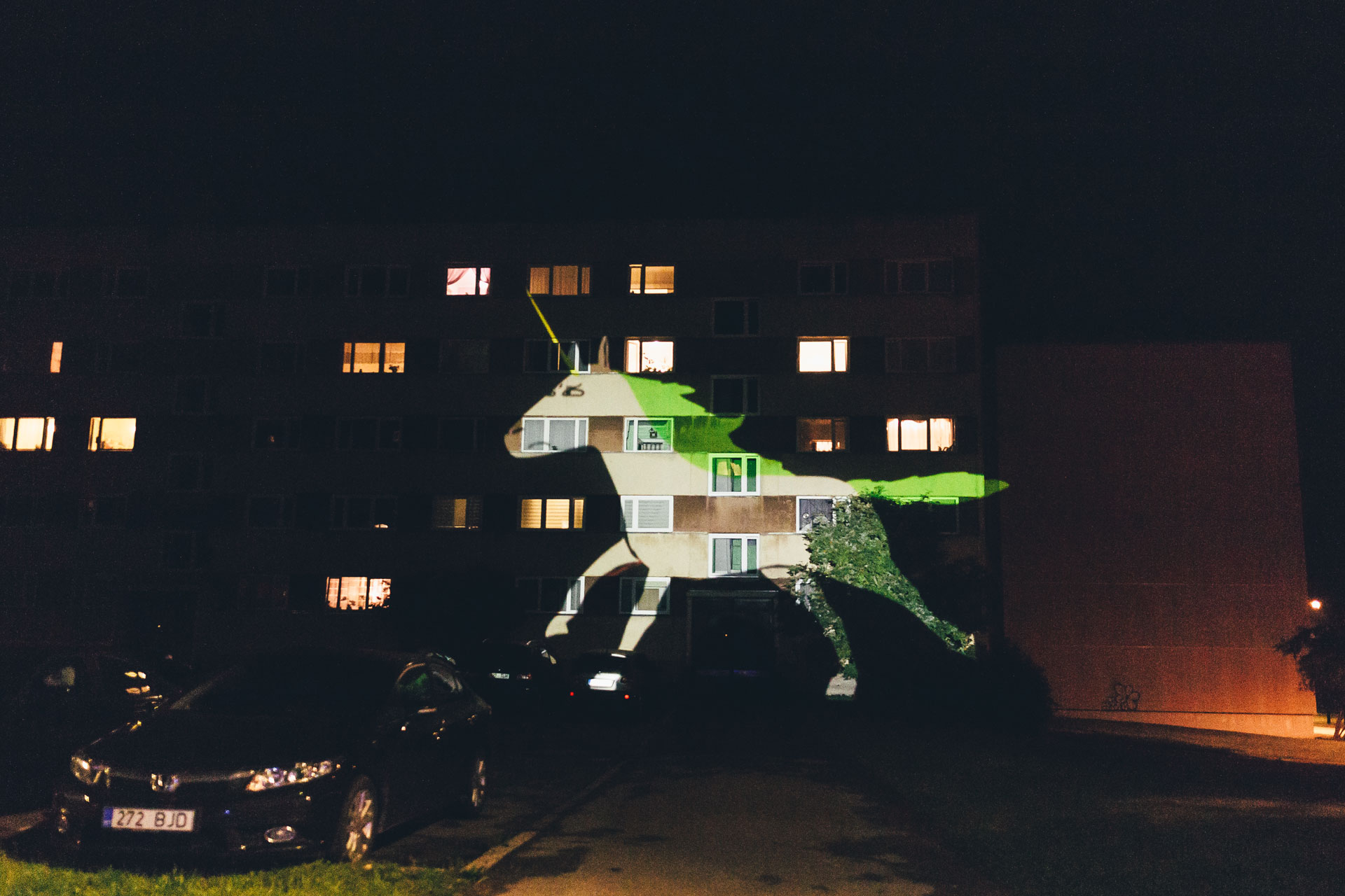 VJ Suave Suaveciclo conducting mobile projection of a white unicorn in Tartu during a bike parade